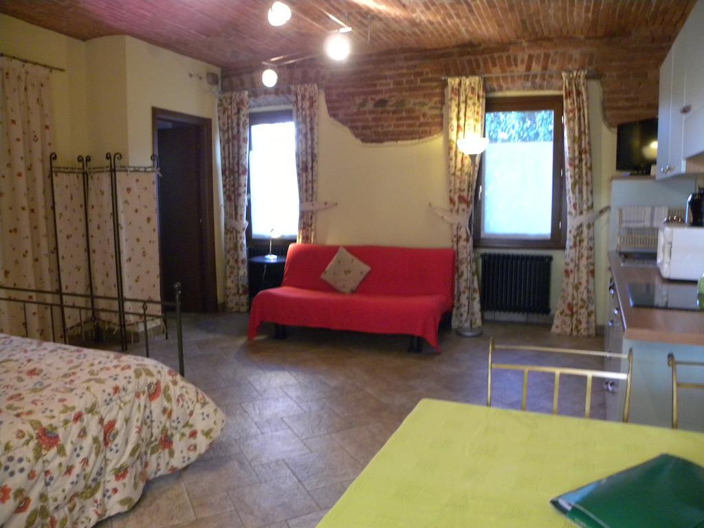 Agriturismo Fano'S Farm Suno Room photo