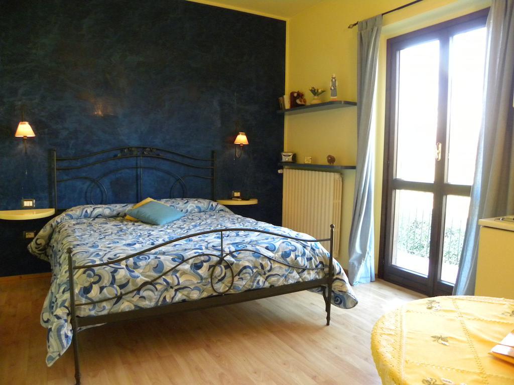 Agriturismo Fano'S Farm Suno Room photo