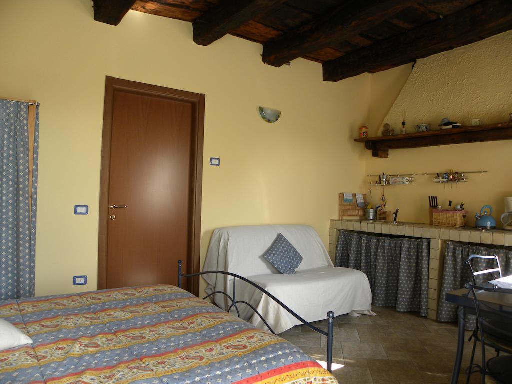 Agriturismo Fano'S Farm Suno Room photo